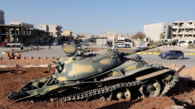 An Islamic State militants' tank is pictured at the Free Women Monument in Kobani, Syria October 11, 2017. Picture taken October 11, 2017. (Photo by Erik De Castro/Reuters)