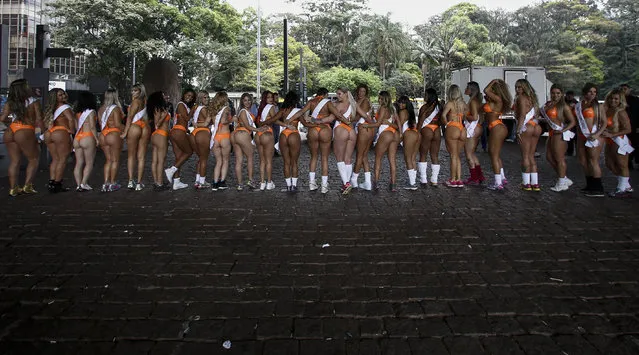 Models in bikinis perform at Paulista Avenue in Sao Paulo, Brazil on August 8, 2016, to promote the Miss Bumbum (buttocks) Brazil 2016 pageant. All eyes are on Brazil's annual Miss Bumbum pageant in Sao Paulo on November, 9 to select the nation's sexiest female derriere. (Photo by Miguel Schincariol/AFP Photo)