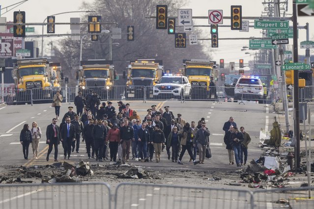 Pennsylvania Gov. Josh Shapiro, Philadelphia Mayor Cherelle Parker and other officials view the aftermath of a fatal small plane crashed in Philadelphia, Monday, February 3, 2025. (Photo by Matt Rourke/AP Photo)