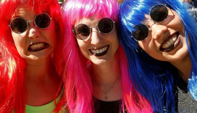 Revellers pose during the Street Parade dance music event in Zurich, Switzerland August 13, 2016. (Photo by Arnd Wiegmann/Reuters)