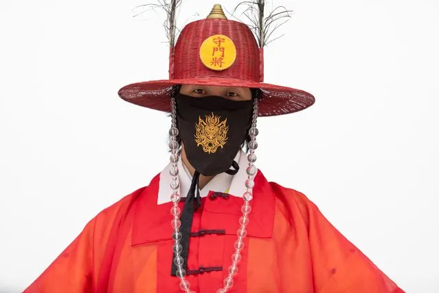 Coronavirus infection (COVID-19) is still continuing in the country, a guard of Gyeongbokgung Palace wears a protective mask with a goblin pattern at the entrance of the palace, which is currently not being opened to the public due to Covid-19 in Seoul, South Korea on June 18, 2020. (Photo by Chris Jung/NurPhoto via Getty Images)