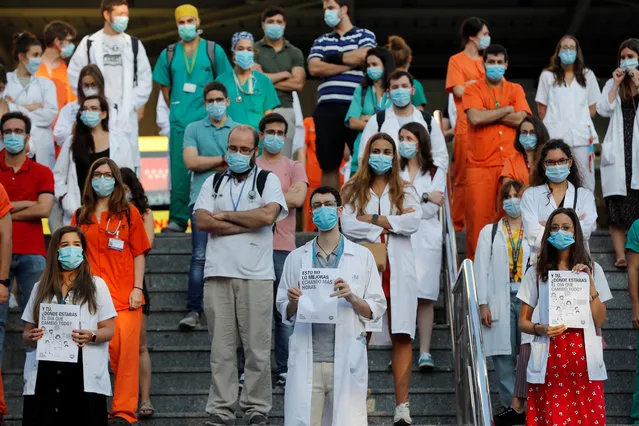 Residents in internal medicine take part in a strike at the gates of their hospital in Madrid, Spain, 13 July 2020. The resident in internal medicine are calling for improved working conditions in their new colletive bargaining agreement. (Photo by Chema Moya/EPA/EFE)