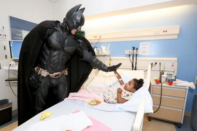 Batman visits patients to celebrate Halloween and Spirit of Children week at Mattel Children's Hospital UCLA on Wednesday, October 15, 2014, in Los Angeles. (Photo by Casey Rodgers/Invision for Spirit Halloween/AP Images)