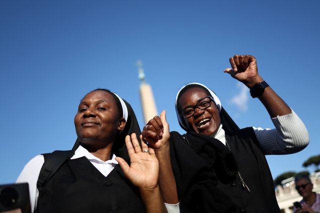Nuns react to the white smoke indicating that a new pope has been elected, at the Vatican, on May 8, 2025. (Photo by Eloisa Lopez/Reuters)