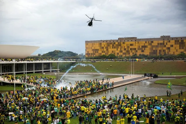 Supporters of Brazil's former President Jair Bolsonaro demonstrate against President Luiz Inacio Lula da Silva, in Brasilia, Brazil, January 8, 2023. (Photo by Antonio Cascio/Reuters)