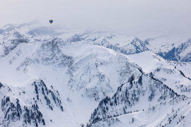 A balloon takes part in the 45th International Hot Air Balloon Festival near Chateau-d'Oex, Switzerland on January 30, 2025. (Photo by Denis Balibouse/Reuters)