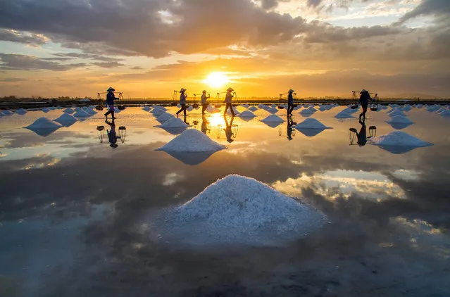 “People Harvesting Salt at Sunset”. Photo by Hoang Giang Hai (Hanoi, Vietnam). Photographed in the Ninh Hoa District, Khanh Hoa Province, Vietnam, August 2012.
