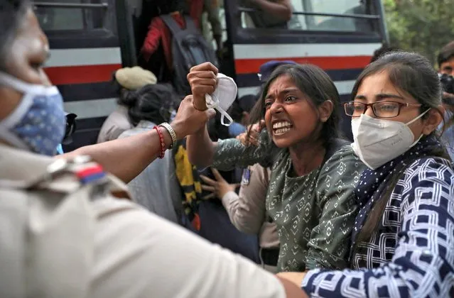Demonstrators are detained by police during a protest after the death of a rape victim, at Delhi University, in New Delhi, India, October 1, 2020. In the latest case of violence against women to grab headlines in India, the 19-year-old woman from the Dalit community died from injuries this week after being attacked on Sept. 14 near her home, authorities said. The Dalit community often faces violence and discrimination. Police have arrested four men for rape. (Photo by Anushree Fadnavis/Reuters)