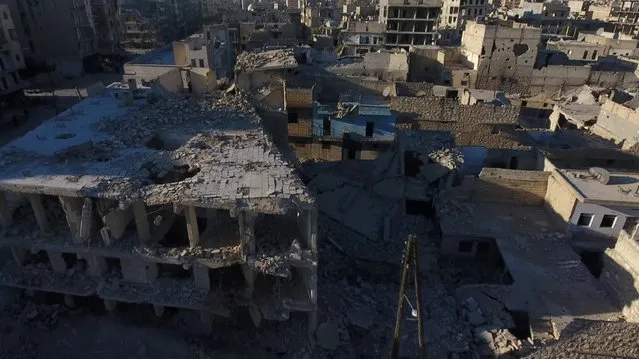 A still image taken on September 27, 2016 from a drone footage obtained by Reuters shows damaged buildings in a rebel-held area of Aleppo, Syria. (Photo by Reuters TV)