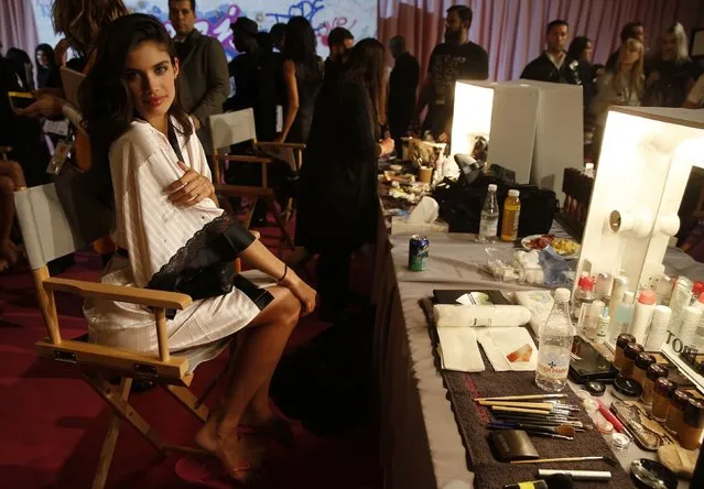 Model Sara Sampaio prepares backstage ahead of the 2014 Victoria's Secret Fashion Show in London December 2, 2014. (Photo by Suzanne Plunkett/Reuters)