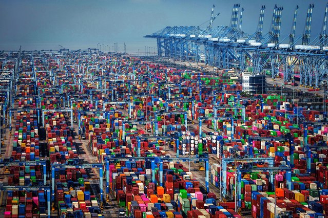Shipping containers are stacked at Westport in Klang on the outskirts of Kuala Lumpur, Malaysia, Friday, April 18, 2025. (Photo by Vincent Thian/AP Photo)