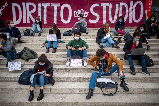 Students attend a remote lesson during a demonstration against the lockdown measures to contain the Covid-19 pandemic, in front of the Ministry of Public Education, on November 4, 2020 in Rome, Italy. The protest is organized by “Rete degli studenti Medi” to protest against the lockdown imposed in Italy to contain the coronavirus pandemic which provide for closure of schools and distance learning. Italy registered over 28200 new infections and 353 deaths in the last 24 hours. (Photo by Antonio Masiello/Getty Images)