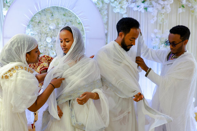 Wedding ceremony of Awoke Asmamaw and Samrawit Tadese at the Ethiopian Orthodox Tewahedo Church in the Petworth neighborhood of Washington, D.C., U.S., August 30, 2025. (Photo by Jose Luis Gonzalez/Reuters)