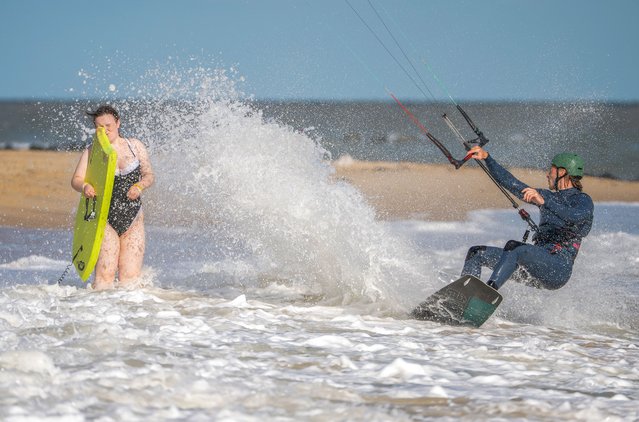 A kite surfer makes the most of the windy weather with a splash at Martello Beach, Clacton-on-Sea in Essex, UK on Thursday, August 28, 2025. (Photo by Kevin Jay/Picture Exclusive)
