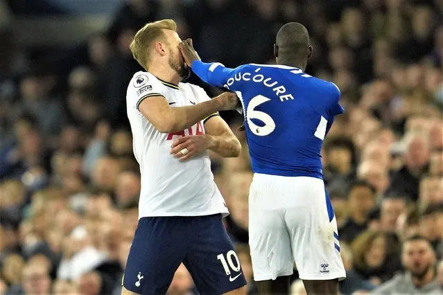 Tottenham's Harry Kane is pushed by Everton's Abdoulaye Doucoure during the English Premier League soccer match between Everton and Tottenham Hotspur at the Goodison Park stadium in Liverpool, England, Monday, April 3, 2023. (Photo by Jon Super/AP Photo)
