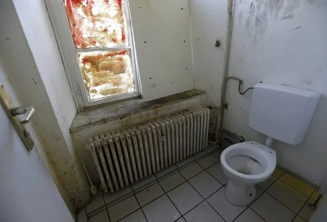A toilet is seen in a hostel for asylum seekers in Augsburg near Munich, southern Germany, August 27, 2015. (Photo by Michaela Rehle/Reuters)