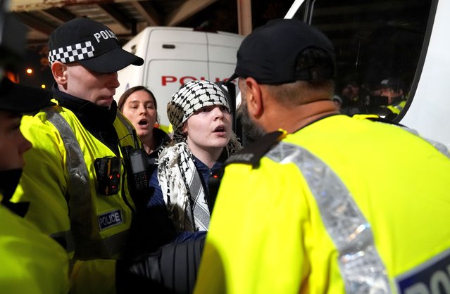 Police officers remove a pro Palestine protester outside Villa Park, home of Aston Villa, before the UEFA Europa League match at Villa Park, Birmingham, UK on Thursday, November 6, 2025. The local Safety Advisory Group (SAG) opted to block Maccabi Tel Aviv supporters from attending tonight's Europa League tie against Aston Villa following a risk assessment by West Midlands Police, a decision which drew immediate criticism from politicians including Prime Minister Sir Keir Starmer. (Photo by Joe Giddens/PA Wire)