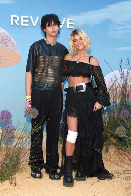 (L-R)  Travis Barker's son, influencer Landon Barker and American social media personality Charli D'Amelio attend the 2023 REVOLVE Festival on April 15, 2023 in Thermal, California. (Photo by Steven Simione/Getty Images)