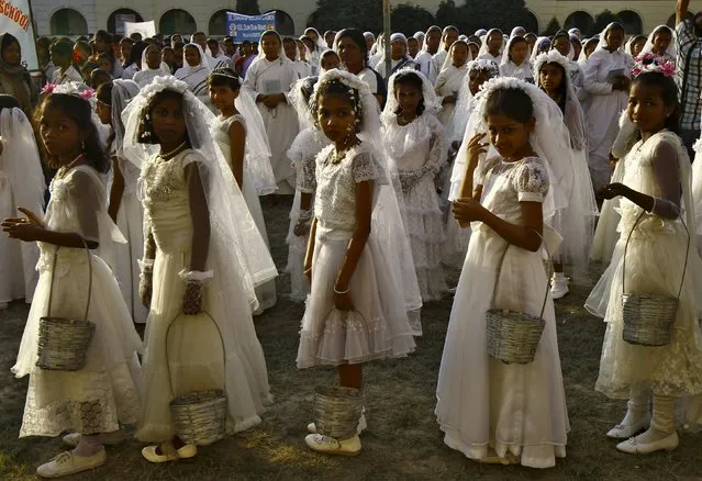 Girls attend a prayer meeting before taking part in a Corpus Christi procession inside a college premises in Kolkata, India, November 22, 2015. (Photo by Rupak De Chowdhuri/Reuters)