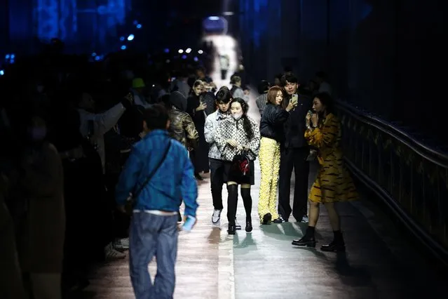 People leave after Louis Vuitton's Pre-Fall 2023 Women's Collection show on a bridge over Han river in Seoul, South Korea on April 29, 2023. (Photo by Kim Soo-Hyeon/Reuters)