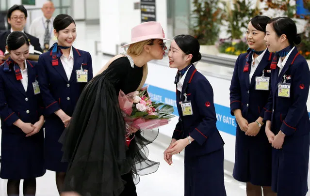 Singer Lady Gaga kisses a Japan Airlines (JAL) staff upon her arrival at Narita International airport in Narita, Japan, November 1, 2016. (Photo by Toru Hanai/Reuters)