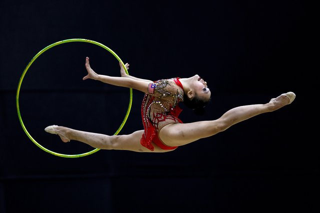 Mavia Wong Weng Qin of Malaysia performs with a hoop during the Rhythmic Gymnastics Qualification and Team Final of the 33rd SEA Games 2025 at Gymnasium 5, Thammasat University Rangsit Campus in Pathum Thani province, Thailand, 15 December 2025. (Photo by Rungroj Yongri/EPA)