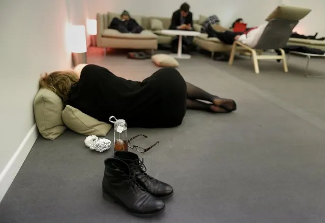 Observers take a rest during the World Climate Change Conference 2015 (COP21) in Le Bourget, near Paris, France, December 10, 2015. (Photo by Jacky Naegelen/Reuters)