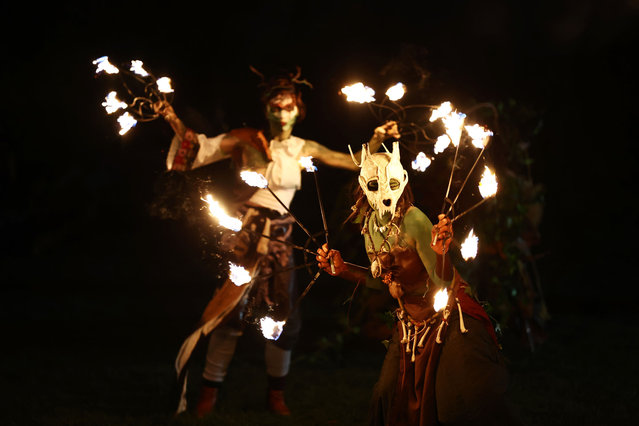 Performers take part in a procession as part of the Samhuinn Fire Festival on October 31, 2024 in Edinburgh, Scotland. The Samhuinn Fire Festival is a modern take on an ancient Celtic festival, marking the transition between summer and winter with fire-dancing, drums, acrobatics, and theatre performances. (Photo by Jeff J. Mitchell/Getty Images)