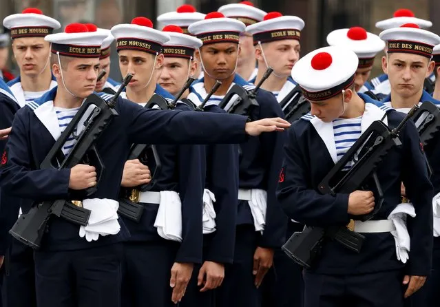 Students of the Ecole des Mousses prepare ahead of ceremonies at The Arc de Triomphe in Paris, France, 08 May 2022, marking the Allied victory against Nazi Germany and the end of World War II in Europe (VE Day). (Photo by Ludovic Marin/EPA/EFE)
