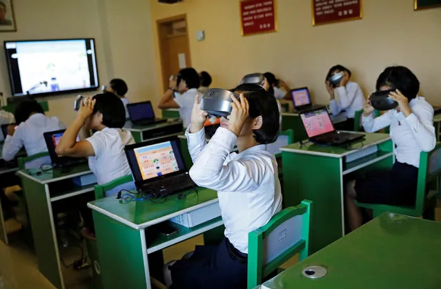 Students use VR glasses during a class at a teachers' training college during a government organised visit for foreign reporters ahead of the 70th anniversary of North Korea's foundation, in Pyongyang, North Korea on September 7, 2018. (Photo by Danish Siddiqui/Reuters)