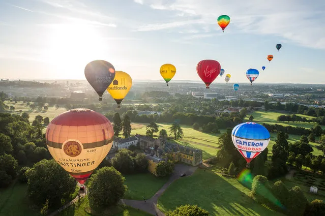Hot air balloons take off from Ashton Court estate, UK on August 7, 2023 for the Bristol International Balloon Fiesta media launch preview for the Fiesta which takes place from this Thursday 10 August to Sunday 13 August. (Photo by Simon Chapman/London News Pictures)