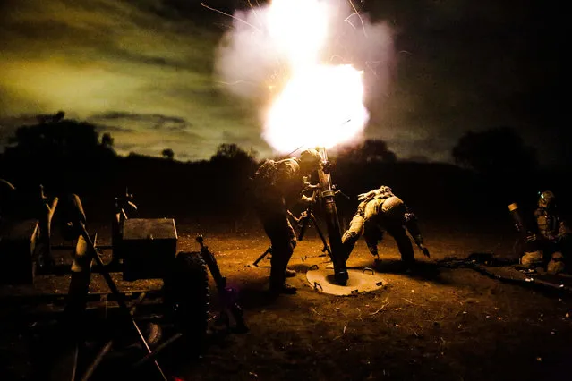 U.S. Army Rangers assigned to 2nd Battalion, 75th Ranger Regiment, fire a 120 mm mortar during a tactical training exercise on Camp Roberts, Calif., January 30, 2014. Rangers constantly train to maintain the highest level of tactical proficiency. (Photo by Pfc. Nathaniel Newkirk/U.S. Army)