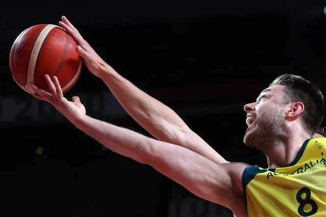 Australia's Matthew Dellavedova goes to the basket in the men's preliminary round group B basketball match between Australia and Germany during the Tokyo 2020 Olympic Games at the Saitama Super Arena in Saitama on July 31, 2021. (Photo by Thomas Coex/AFP Photo)