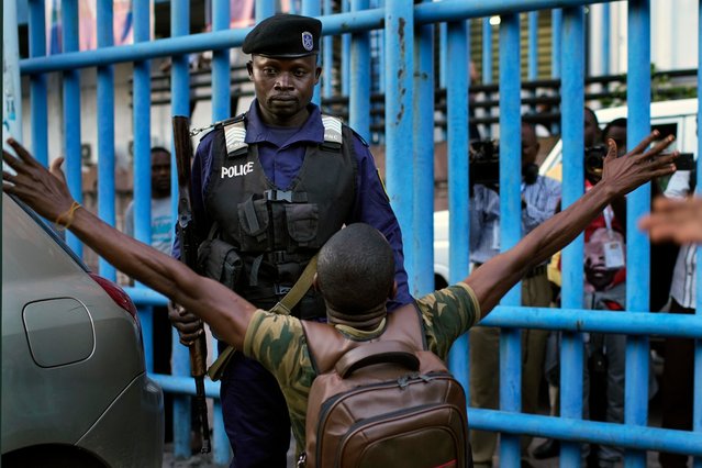 Fiston Adumba, 32, an opposition supporter, reacts to an announcement of postponed elections in Kinshasa, Democratic Republic of the Congo, on Thursday December 20, 2018. The electoral commission has delayed the country's long-awaited presidential election until Dec. 30, citing problems caused by a recent fire that destroyed 80 percent of the voting machines in the capital. (Photo by Jerome Delay/AP Photo)