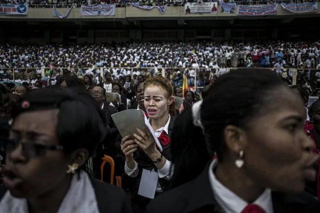 A Catholic choir sings during the inauguration of the new Archbishop of Kinshasa, Fridolin Ambongo  in Kinshasa, Congo on November 25, 2018. (Photo by John Wessels/AFP Photo)