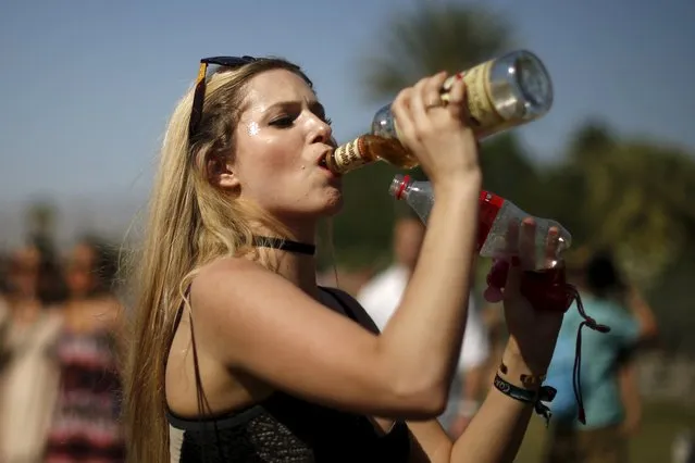 A woman swigs from bottles of rum and coke before entering the Coachella Valley Music and Arts Festival in Indio, California April 12, 2015. (Photo by Lucy Nicholson/Reuters)
