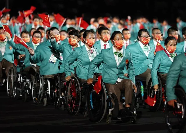 China's team arrive during the opening ceremony for the Tokyo 2020 Paralympic Games at the Olympic Stadium in Tokyo on August 24, 2021. (Photo by Lisi Niesner/Reuters)