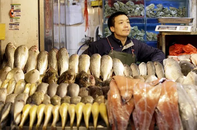A vendor waits for customers at his shop in a market in Beijing February 18, 2016. (Photo by Jason Lee/Reuters)