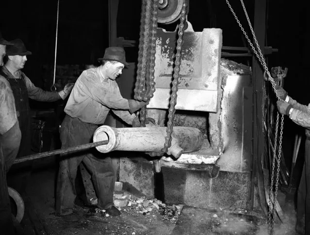 A Civil War cannon which decorated the University of Colorado campus at Boulder is going the way of all good metal to World War II. The old ball and fuse type firing piece is being pounded into chunks by a steam hammer operated by Dewey Felder in Denver, Colorado, September 9, 1942. The fragments will be melted and converted into naval war weapons by a Denver war plant. (Photo by AP Photo)
