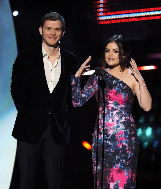 Actors Joseph Morgan (L) and Lucy Hale speak onstage at The 40th Annual People's Choice Awards at Nokia Theatre L.A. Live on January 8, 2014 in Los Angeles, California. (Photo by Kevin Winter/Getty Images)