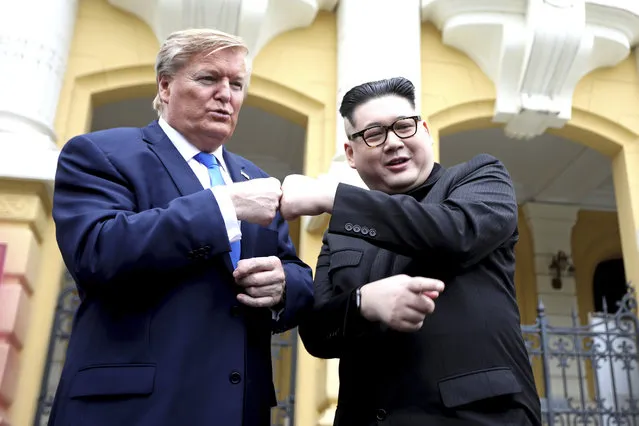 U.S. President Donald Trump impersonator Russell White, left, and Kim Jong-un impersonator Howard X pose for photos outside the Opera House in Hanoi, Vietnam, Friday, February 22, 2019. The second summit between Trump and Kim will take place in Hanoi on Feb. 27 and 28. (Photo by Minh Hoang/AP Photo)