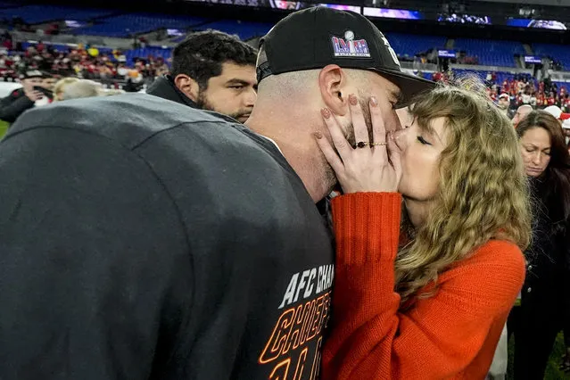 American singer-songwriter Taylor Swift kisses Kansas City Chiefs tight end Travis Kelce after an AFC Championship NFL football game against the Baltimore Ravens, Sunday, January 28, 2024, in Baltimore. The Kansas City Chiefs won 17-10. (Photo by Julio Cortez/AP Photo)