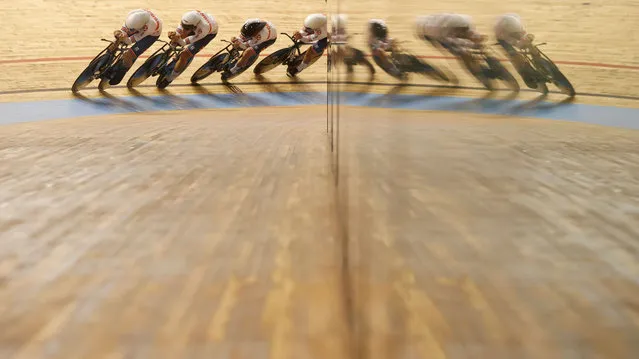 Members of the Russian Cycling Federation ride during the men's-team-pursuit qualifying heat 8 at the UCI Track Cycling World Championships in Roubaix, France, on October 20, 2021. (Photo by Christian Hartmann/Reuters)