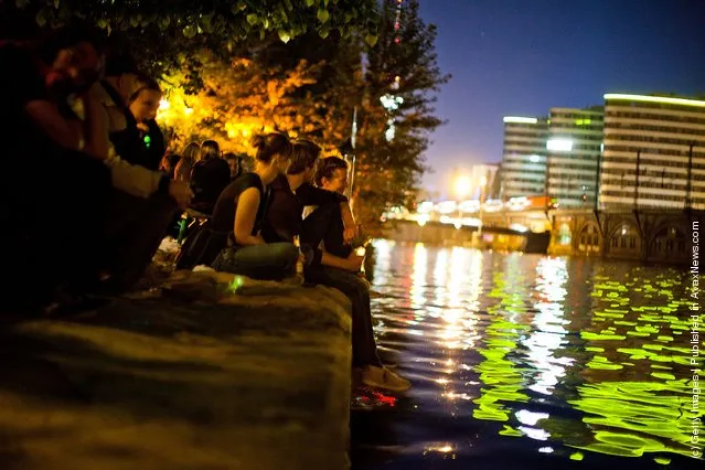 Guests spend the evening in the beach bars in Berlin, Germany