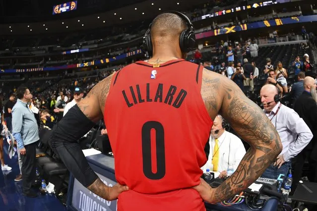 Portland Trail Blazers guard Damian Lillard talks to radio broadcasters after Game 7 of an NBA basketball second-round playoff series against the Denver Nuggets, Sunday, May 12, 2019, in Denver. (Photo by John Leyba/AP Photo)