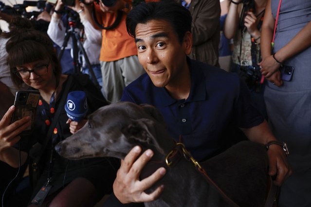 Taiwanese actor Eddie Peng, cast member of the film “Black Dog” poses with dog Xin, who won the Grand Prix Palm Dog award, during the 77th Cannes Film Festival in Cannes, France, on May 24, 2024. (Photo by Sarah Meyssonnier/Reuters)