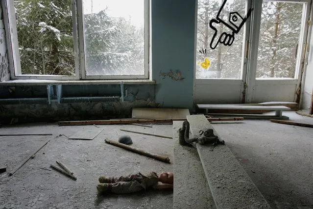 Toys and a gas mask lay in dust, in an abandoned pre school in the deserted city of Pripyat on January 25, 2006 in Chernobyl, Ukraine. Prypyat and the surrounding area will not be safe for human habitation for several centuries. Scientists estimate that the most dangerous radioactive elements will take up to 900 years to decay sufficiently to render the area safe. (Photo by Daniel Berehulak/Getty Images)