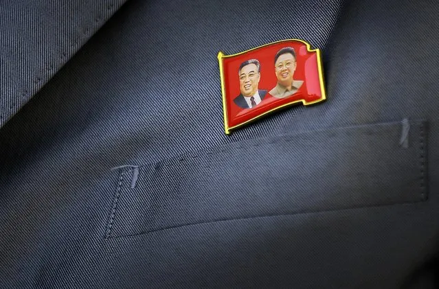 A pin of the late North Korea leaders Kim Il Sung, left, and Kim Jong Il is displayed on North Korean man's suit Saturday, May 7, 2016 in Pyongyang, North Korea. (Photo by Wong Maye-E/AP Photo)