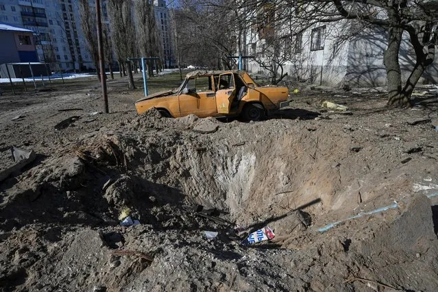 A shell crater in seen at a residential area amid Russia's attack on Ukraine, in Sievierodonetsk, Luhansk region, Ukraine on March 21, 2022. (Photo by Oleksii Kovalov/Reuters)