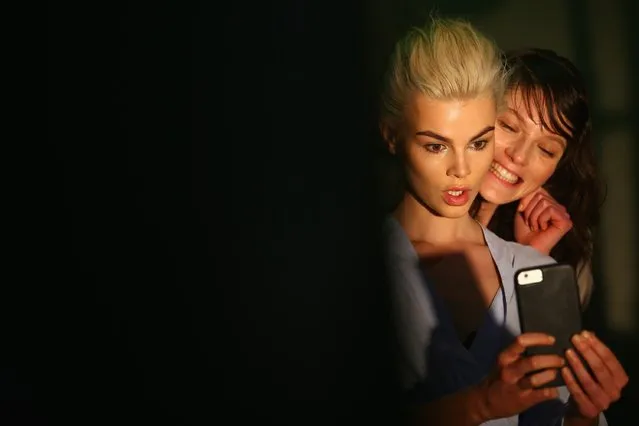 Models take a selfie as they prepare backstage ahead of the Bec & Bridge show at Mercedes-Benz Fashion Week Resort 17 Collections at Carriageworks on May 17, 2016 in Sydney, Australia. (Photo by Mark Nolan/Getty Images)
